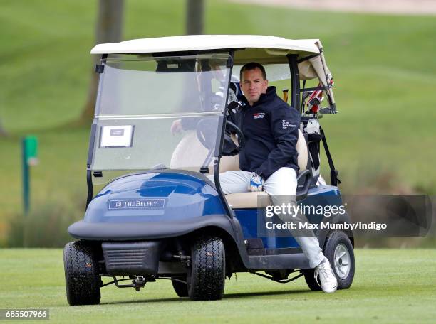 Peter Phillips drives a golf buggy as he takes part in the 5th edition of the 'ISPS Handa Mike Tindall Celebrity Golf Classic' at The Belfry on May...