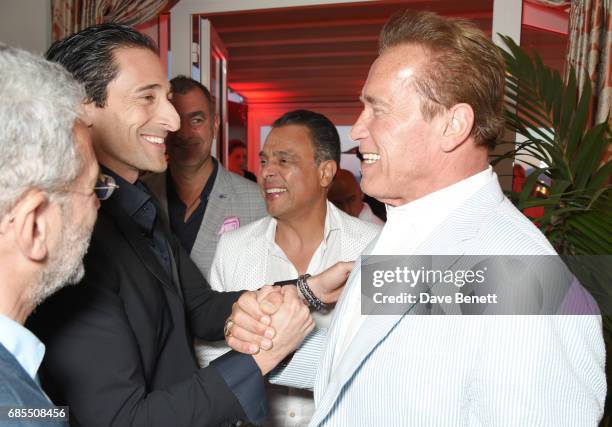 Adrien Brody and Arnold Schwarzenegger attend The 9th Annual Filmmakers Dinner hosted by Charles Finch and Jaeger-LeCoultre at Hotel du Cap-Eden-Roc...