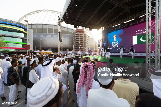 Fans enjoy entertainment in the fan zone outside the stadium at Khalifa International Stadium on May 19, 2017 in Doha, Qatar.