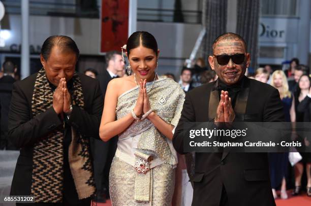 Actors Vithaya Pansringarm, Pornchanok Mabklang and Panya Yimumphai attend the "A Prayer Before Dawn" screening during the 70th annual Cannes Film...