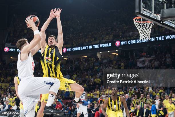 Luka Doncic, #7 of Real Madrid competes with Nikola Kalinic,Ê#33 of Fenerbahce Istanbul during the Turkish Airlines EuroLeague Final Four Semifinal A...