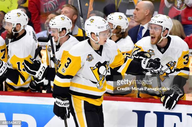 Olli Maatta of the Pittsburgh Penguins celebrates with his teammates after scoring a goal against Craig Anderson of the Ottawa Senators during the...