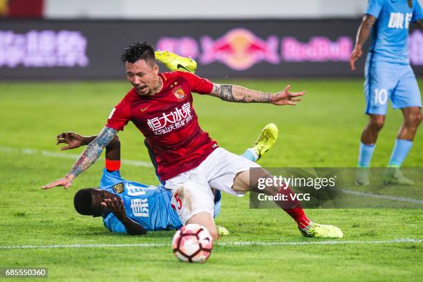 Zhang Linpeng of Guangzhou Evergrande and Ramires of Jiangsu Suning compete for the ball during the 10th round match of 2017 Chinese Football...