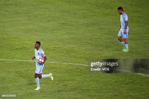 Ramires and Alex Teixeira of Jiangsu Suning react after losing a goal during the 10th round match of 2017 Chinese Football Association Super League...