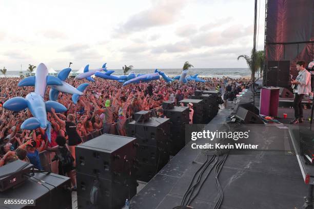 Musician Andrew VanWyngarden of MGMT performs at the Hangout Stage as Inflatable Whales crowd surf over festivalgoers during 2017 Hangout Music...