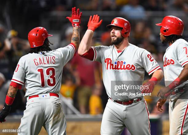 Cameron Rupp celebrates his home run with Freddy Galvis of the Philadelphia Phillies during the ninth inning against the Pittsburgh Pirates at PNC...