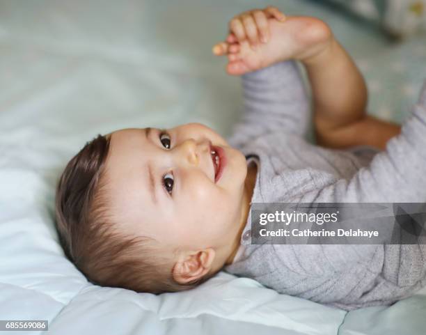 portrait of a 8 months old baby boy - baby boys stock pictures, royalty-free photos & images