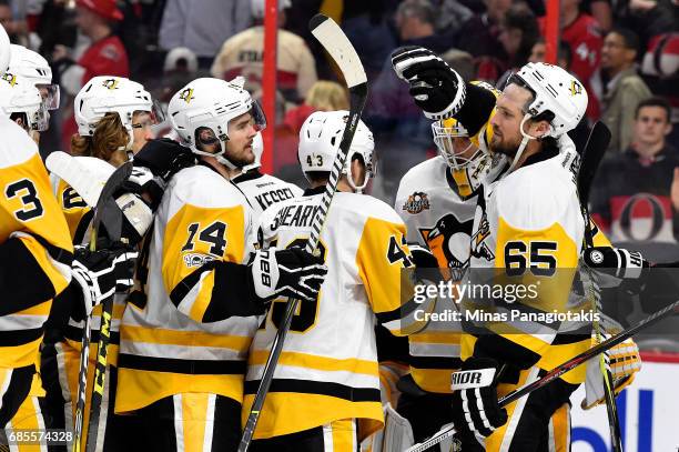 Ron Hainsey of the Pittsburgh Penguins celebrates with Chris Kunitz after defeating the Ottawa Senators with a score of 3 to 2 in Game Four of the...