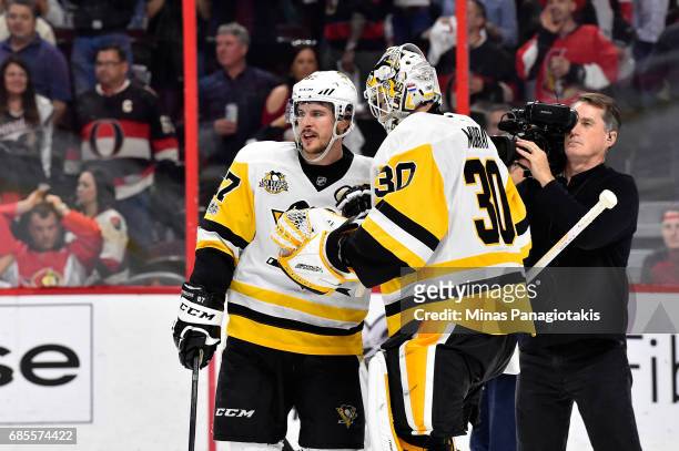Sidney Crosby and Matt Murray of the Pittsburgh Penguins talk after defeating the Ottawa Senators with a score of 3 to 2 in Game Four of the Eastern...