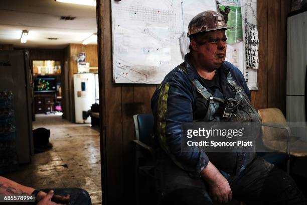 Coal miner Doug Rutherford takes a break after his shift at a small mine on May 19, 2017 outside the city of Welch, West Virginia. West Virginia, a...