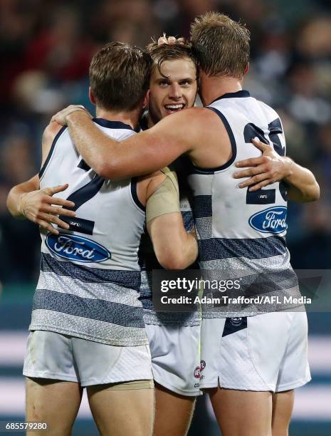 Zach Tuohy, Jake Kolodjashnij and Lachie Henderson of the Cats celebrate on the final siren during the 2017 AFL round 09 match between the Geelong...