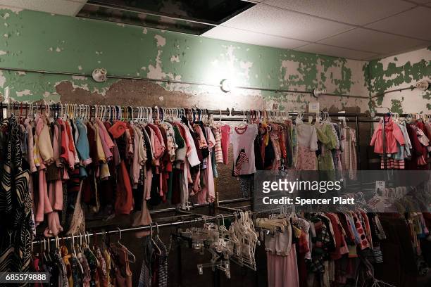 Children's pre-owned clothing is displayed at the Hope Chest, a charity clothing and furniture store on May 19, 2017 in Welch, West Virginia. West...