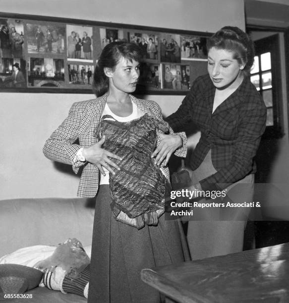 Italian actress Marisa Allasio , trying a swimsuit on before attending to the III Cinema Rally. Italy, 1956