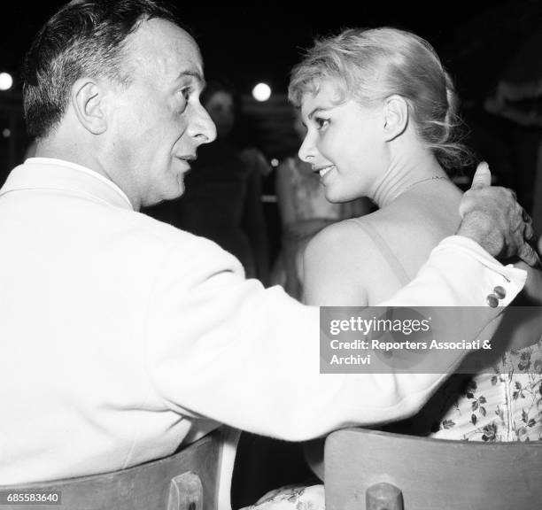 Italian actress Marisa Allasio with famous dressmaker Emilio Federico Schuberth during the beauty pageant 'Miss Belvedere delle Rose' , in the Roman...