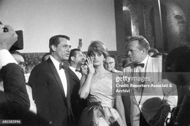 British-born American actor Cary Grant , Italian actress Sophia Loren and Amnerican actor Van Heflin at the David di Donatello award ceremony in the...