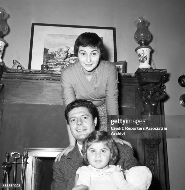 Italian actor Marcello Mastroianni , his wife and actress Flora Carabella and their daughter Barbara posing in their house for a photo shooting. 1955