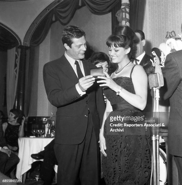 Italian actor Marcello Mastroianni at Rupe Tarpea to deliver the "Arancia d'Oro" award to Italian actress Claudia Cardinale . Rome , 1st March 1961