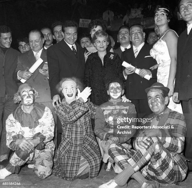 Italian actress Giulietta Masina posing in the middle with many people among which Italian circus queen and actress Moira Orfei and Italian actor Ugo...