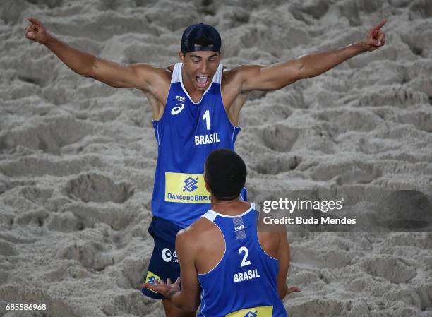 Saymon Barbosa Santos and Alvaro Morais Filho of Brazil celebrate the victory after the Men's Round of 02 match against Andre Loyola Stein and...