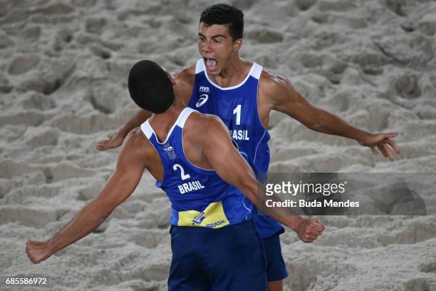Saymon Barbosa Santos and Alvaro Morais Filho of Brazil celebrate the victory after the Men's Round of 02 match against Andre Loyola Stein and...