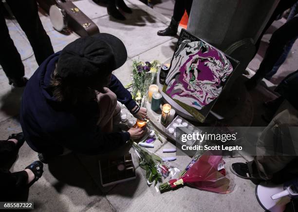 Fans attend the candlelight vigil to mourn the death of singer Chris Cornell at the Fox Theatre, the venue where Chris Cornell performed his final...