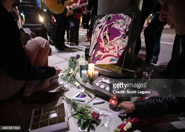 Fans attend the candlelight vigil to mourn the death of singer Chris Cornell at the Fox Theatre, the venue where Chris Cornell performed his final...