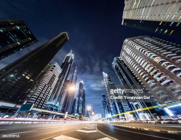 rush hour traffic on sheikh zayed road at night - dubai road stock pictures, royalty-free photos & images