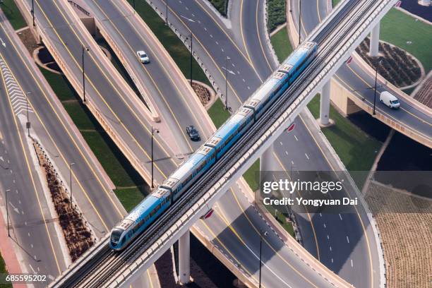 aerial view of a dubai metro train - futuristic train stock pictures, royalty-free photos & images