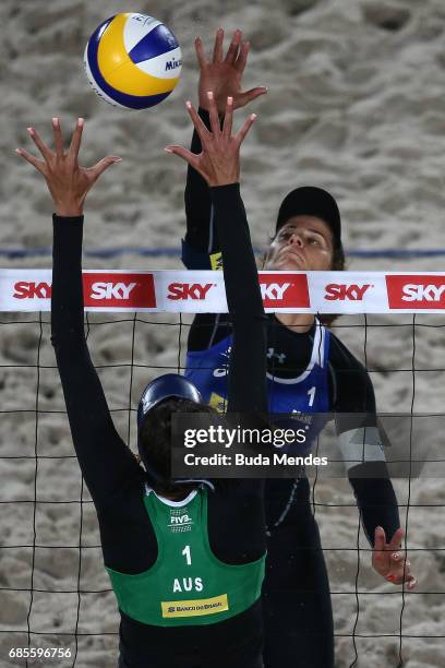 Larissa Frana Maestrini of Brazil spikes the ball against Taliqua Clancy of Australia during the main draw match at Olympic Park during day two of...