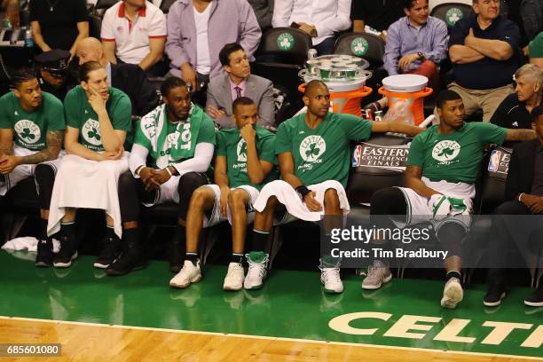 Boston Celtics players including Kelly Olynyk, Jae Crowder, Avery Bradley, Al Horford and Marcus Smart react on the bench during the fourth quarter...