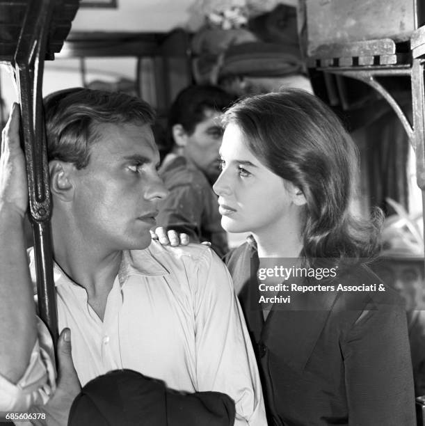 Eleonora Rossi Drago resting her hand on French actor Jean Louis Trintignant's shoulder in a scene from the film 'Violent Summer', directed by...