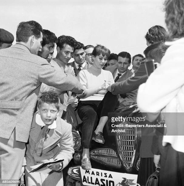 Italian actress Marisa Allasio signing autographs at the III Cinema Rally. Italy, 1956