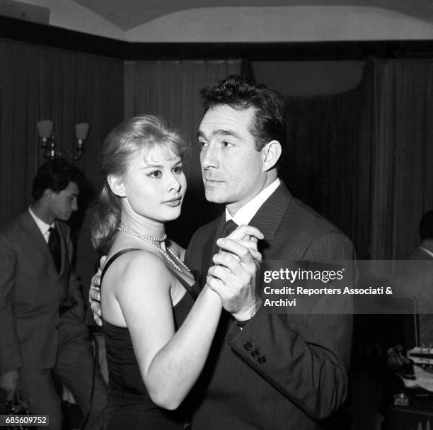 Italian actors Ugo Tognazzi and Marisa Allasio dancing in the famous Roman club Kit Kat for the election party of Miss Cocktail. Rome, 1957