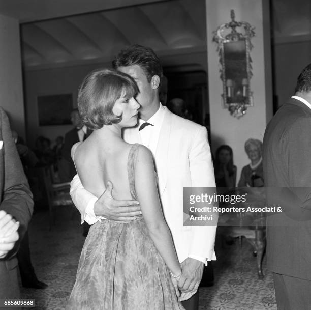 Italian actress Stefania Sandrelli and French actor Jacques Charrier dancing during a party on the ship Regina Isabella II. 1965