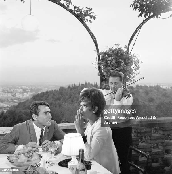 Italian actor, comedian and TV host Walter Chiari and Italian actress Lea Massari having dinner in a scene of the anthology movie directed by Nanni...