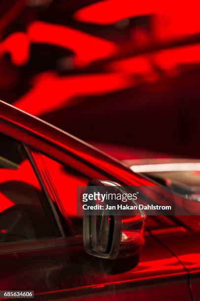 neon reflections in cars - auto rot stock-fotos und bilder
