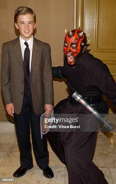 Actor Haley Joel Osment poses with Star Wars character Darth Maul at the 28th Annual Saturn Awards presented by the Academy of Science Fiction,...