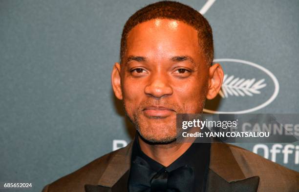 Actor Will Smith poses as he arrives for the Chopard "Space" party on the sidelines of the 70th Cannes film festival, on May 19, 2017 in Cannes,...