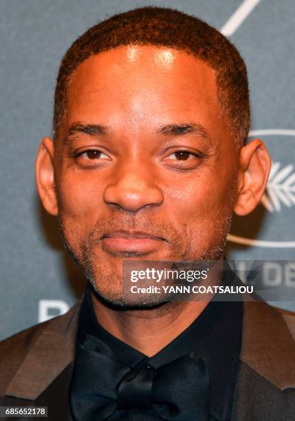 Actor Will Smith poses as he arrives for the Chopard "Space" party on the sidelines of the 70th Cannes film festival, on May 19, 2017 in Cannes,...