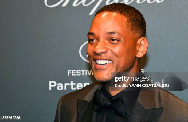 Actor Will Smith poses as he arrives for the Chopard "Space" party on the sidelines of the 70th Cannes film festival, on May 19, 2017 in Cannes,...