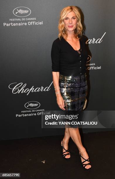 French actress Michelle Laroque poses as she arrives for the Chopard "Space" party on the sidelines of the 70th Cannes film festival, on May 19, 2017...