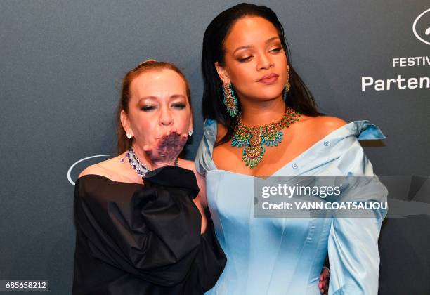 German Chopard co-President Caroline Scheufele and US Singer Rihanna pose upon arrival for the Chopard "Space" party on the sidelines of the 70th...