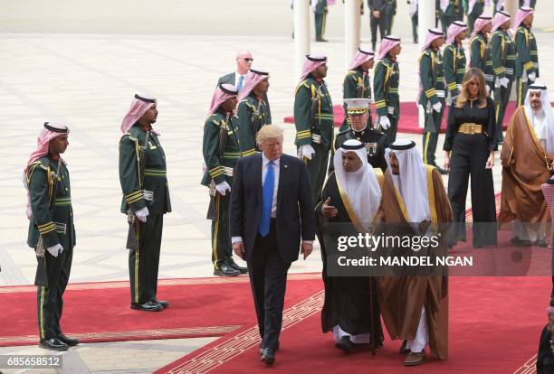 President Donald Trump is welcomed by Saudi King Salman bin Abdulaziz al-Saud upon arrival at King Khalid International Airport in Riyadh on May 20...