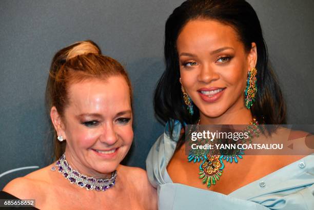 German Chopard co-President Caroline Scheufele and US Singer Rihanna pose upon arrival for the Chopard "Space" party on the sidelines of the 70th...