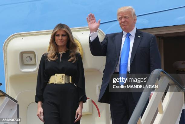 President Donald Trump and First Lady Melania Trump step off Air Force One upon arrival at King Khalid International Airport in Riyadh on May 20,...
