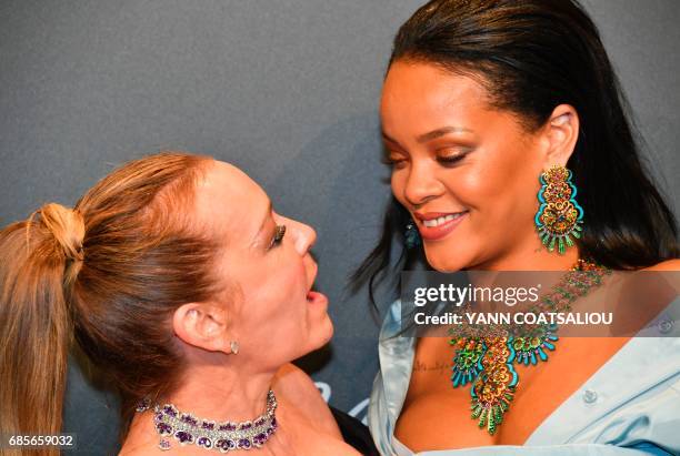 German Chopard co-President Caroline Scheufele and US Singer Rihanna pose upon arrival for the Chopard "Space" party on the sidelines of the 70th...