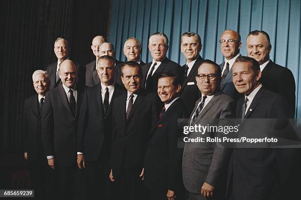 View of Republican party politician and President elect of the United States, Richard Nixon pictured in centre with his chosen cabinet members in...