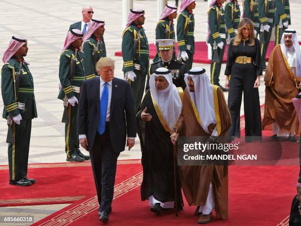 President Donald Trump is welcomed by Saudi King Salman bin Abdulaziz al-Saud upon arrival at King Khalid International Airport in Riyadh on May 20...