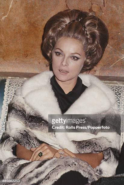 Italian actress Virna Lisi who stars in the film 'Anyone Can Play' pictured wearing a fur coat during an interview in Rome, Italy in 1968.
