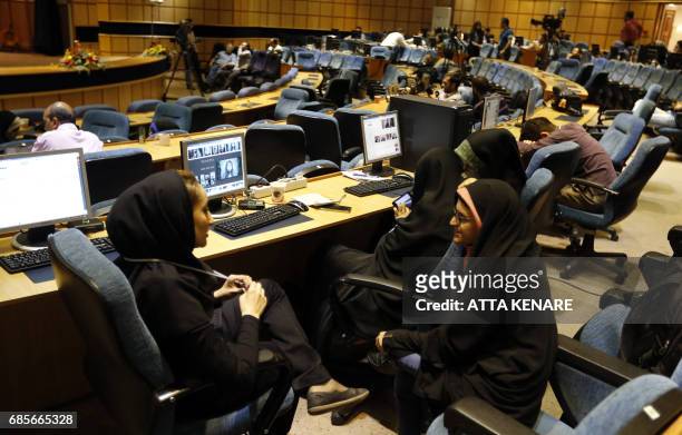 Iranian journalists follow the results of the Presidential election at the Interior Ministry's press room in the capital Tehran on May 20, 2017.